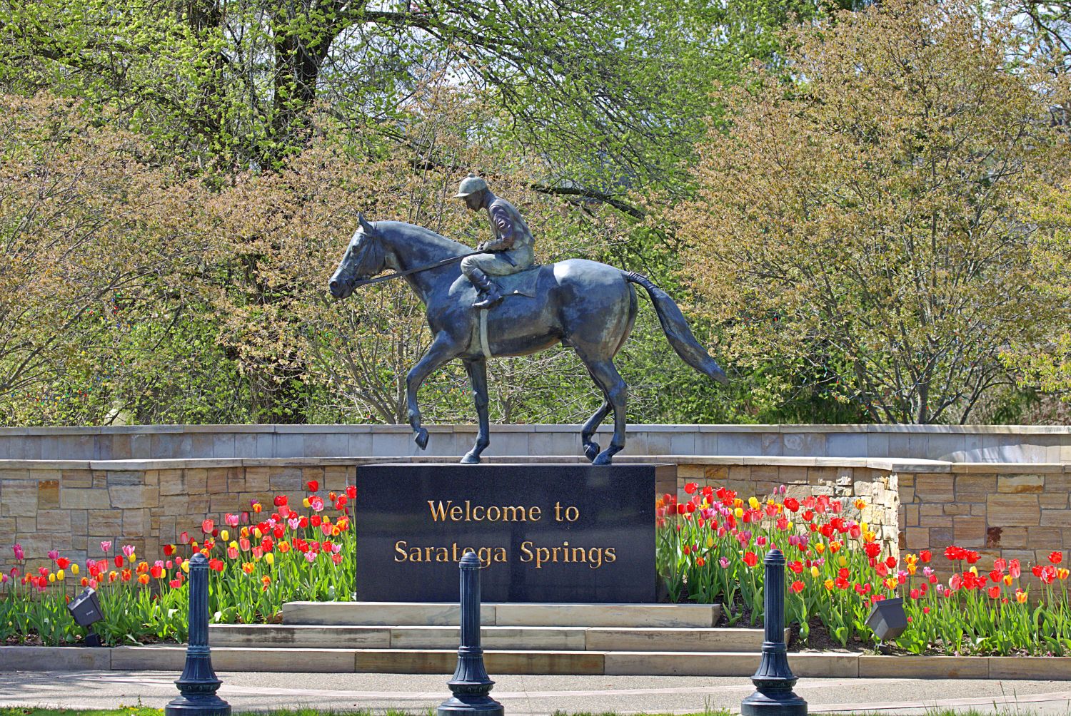 Welcome to Saratoga Springs — Jockey Statue & Spring Tulips Photography Print