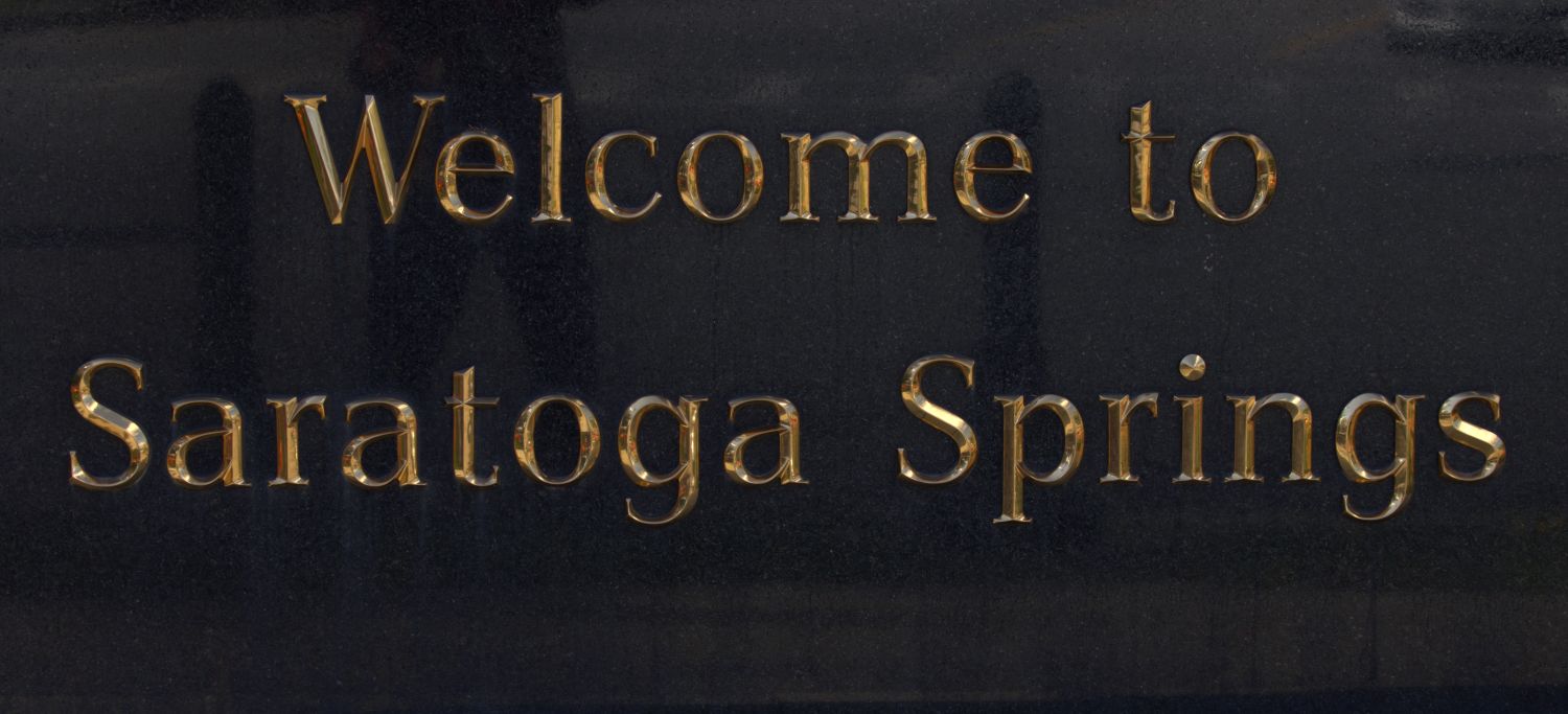 Welcome to Saratoga Springs — Gold Lettering Close-Up Photography Print